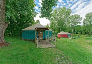 Luxury glamping yurt by a tree on Andelyn Farm